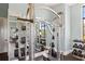 Fully equipped weight room with mirrors and a variety of dumbbells and weight machines at 7130 Westhill Ct, Lakewood Ranch, FL 34202