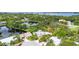 A bird's eye view of a delightful house surrounded by a lush neighborhood with a serene pond at 7615 4Th Avenue Nw Dr, Bradenton, FL 34209