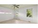 Well-lit bedroom with a ceiling fan and multiple windows at 7615 4Th Avenue Nw Dr, Bradenton, FL 34209
