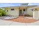 Charming home entrance featuring a brick walkway and covered porch at 7615 4Th Avenue Nw Dr, Bradenton, FL 34209