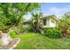 Well-manicured yard showcases lush landscaping and mature shade trees at 7615 4Th Avenue Nw Dr, Bradenton, FL 34209