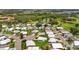 Picturesque aerial of a residential area with scenic golf course views and a tranquil lake nearby at 8470 Imperial Cir, Palmetto, FL 34221