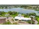 Beautiful aerial view of clubhouse with two pools, lake and surrounding landscaping at 8470 Imperial Cir, Palmetto, FL 34221