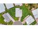 Overhead view of the home, showing meticulous landscaping and neighborhood features at 8470 Imperial Cir, Palmetto, FL 34221