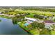Overhead view of the clubhouse offering a pool, shuffleboard, and lake access at 8470 Imperial Cir, Palmetto, FL 34221