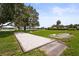 Outdoor bocce ball court showcases recreational activity, open green spaces, and manicured landscaping at 8470 Imperial Cir, Palmetto, FL 34221