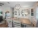 Elegant dining room with a wooden table, seating for six, and a decorative chandelier at 8470 Imperial Cir, Palmetto, FL 34221