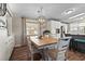 Inviting dining room with a wooden table, six chairs, and stylish lighting fixture at 8470 Imperial Cir, Palmetto, FL 34221