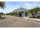 Inviting view of the entrance, complete with a covered walkway and decorative landscaping at 8470 Imperial Cir, Palmetto, FL 34221
