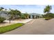 Inviting exterior view of the building, with manicured landscaping and ample parking at 8470 Imperial Cir, Palmetto, FL 34221