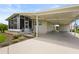 Inviting single-story home boasts a covered carport and lovely landscaping in a well-maintained community at 8470 Imperial Cir, Palmetto, FL 34221