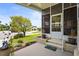 Charming screened front porch with inviting landscape and beautiful curb appeal in a desirable neighborhood at 8470 Imperial Cir, Palmetto, FL 34221
