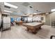 Recreation room featuring billiard tables, seating, and lighting, perfect for entertainment and socializing at 8470 Imperial Cir, Palmetto, FL 34221