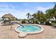Relaxing community hot tub with a tranquil setting and lush landscaping, perfect for unwinding at 8470 Imperial Cir, Palmetto, FL 34221