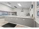 Community kitchen featuring a large counter, appliances, and plenty of counter space for food preparation at 8470 Imperial Cir, Palmetto, FL 34221