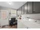 Bright laundry area with cabinets, a workspace, and appliances, offering functionality at 8470 Imperial Cir, Palmetto, FL 34221