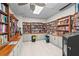 Cozy library featuring floor-to-ceiling bookcases, ample lighting, and quiet reading spaces at 8470 Imperial Cir, Palmetto, FL 34221