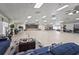 Spacious meeting room offers ample seating, wood floors, and a stage with curtains for community events at 8470 Imperial Cir, Palmetto, FL 34221