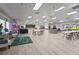 The community meeting room with seating areas, wood floors, and a stage for social gatherings and events at 8470 Imperial Cir, Palmetto, FL 34221
