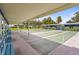 Outdoor shuffleboard courts offer a fun recreational activity amid the sunshine and blue skies at 8470 Imperial Cir, Palmetto, FL 34221
