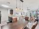 Dining area open to the kitchen and living room, bathed in natural light, providing a seamless flow at 8827 Manor Loop # 208, Lakewood Ranch, FL 34202