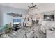 An open-concept living room flows into the dining area and kitchen, offering a modern and inviting space at 8827 Manor Loop # 208, Lakewood Ranch, FL 34202