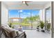 Relaxing screened balcony with comfortable seating and a serene water view at 1000 San Lino Cir # 1032, Venice, FL 34292