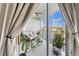Relaxing screened balcony with comfortable seating and a serene water view at 1000 San Lino Cir # 1032, Venice, FL 34292