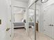 Bright bedroom entrance with tiled floors, tray ceilings, and a mirrored closet at 1000 San Lino Cir # 1032, Venice, FL 34292