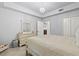 Bedroom featuring an elegant chandelier and a large dresser at 1000 San Lino Cir # 1032, Venice, FL 34292