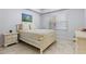 Bright bedroom with neutral tones, tile floors, and ample natural light at 1000 San Lino Cir # 1032, Venice, FL 34292