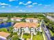 Beautiful exterior of a condominium building with lush landscaping and a peaceful lake view at 1000 San Lino Cir # 1032, Venice, FL 34292