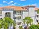 Exterior of condominium with balconies, landscaping, and a well-maintained facade at 1000 San Lino Cir # 1032, Venice, FL 34292