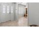 Inviting foyer with tile flooring and an entryway into a bright, airy room at 1000 San Lino Cir # 1032, Venice, FL 34292