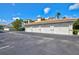 Attached garages under a red tile roof with ample parking space in front at 1000 San Lino Cir # 1032, Venice, FL 34292