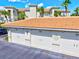 Close up of attached garages under a red tile roof at 1000 San Lino Cir # 1032, Venice, FL 34292