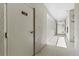 Well-lit hallway featuring textured walls and a clearly marked storage room door at 1000 San Lino Cir # 1032, Venice, FL 34292
