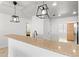 Kitchen featuring granite countertop island and decorative pendant lights at 1000 San Lino Cir # 1032, Venice, FL 34292