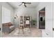 Bright living room with tile floors, neutral walls and plenty of light with view of the kitchen at 1000 San Lino Cir # 1032, Venice, FL 34292
