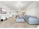Spacious living room featuring tile floors, a chandelier, and an open layout at 1000 San Lino Cir # 1032, Venice, FL 34292