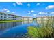 Scenic view of community buildings reflected in a serene pond at 1000 San Lino Cir # 1032, Venice, FL 34292