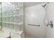 Modern shower with glass block accent and chrome fixtures at 1000 San Lino Cir # 1032, Venice, FL 34292