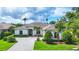 A manicured front yard and well-maintained landscaping create curb appeal for this lovely home at 1017 Tuscany Blvd, Venice, FL 34292