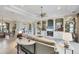 Elegant living room with built-ins, tile floors, lots of natural light and access to the dining room at 1017 Tuscany Blvd, Venice, FL 34292