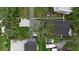 Bird's eye view of the property showcasing the roof, yard, and surrounding greenery at 112 17Th E St, Bradenton, FL 34208