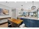 Stylish kitchen area with stainless steel appliances, an island, and modern pendant lighting fixtures at 112 17Th E St, Bradenton, FL 34208