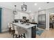 Modern kitchen with stainless steel appliances, quartz countertops, and a breakfast bar at 112 17Th E St, Bradenton, FL 34208