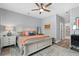 Inviting main bedroom with soft colors, ceiling fan, and ensuite bath access at 112 17Th E St, Bradenton, FL 34208