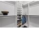 Spacious walk-in closet featuring ample shelving, hanging space, and organized storage solutions at 112 17Th E St, Bradenton, FL 34208