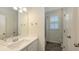 Bright bathroom with a vanity, shower, and window for natural light at 11223 Spring Gate Trl, Bradenton, FL 34211